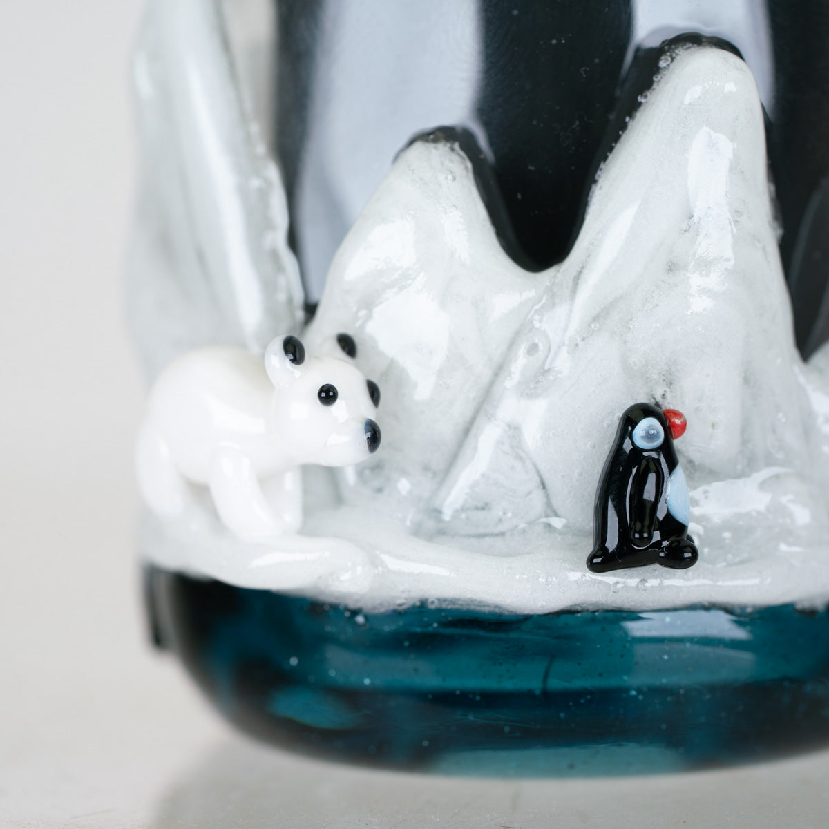 Close-up of Avenge the Arctic Proxy Core attachment showing detailed arctic wildlife and icy glass artwork