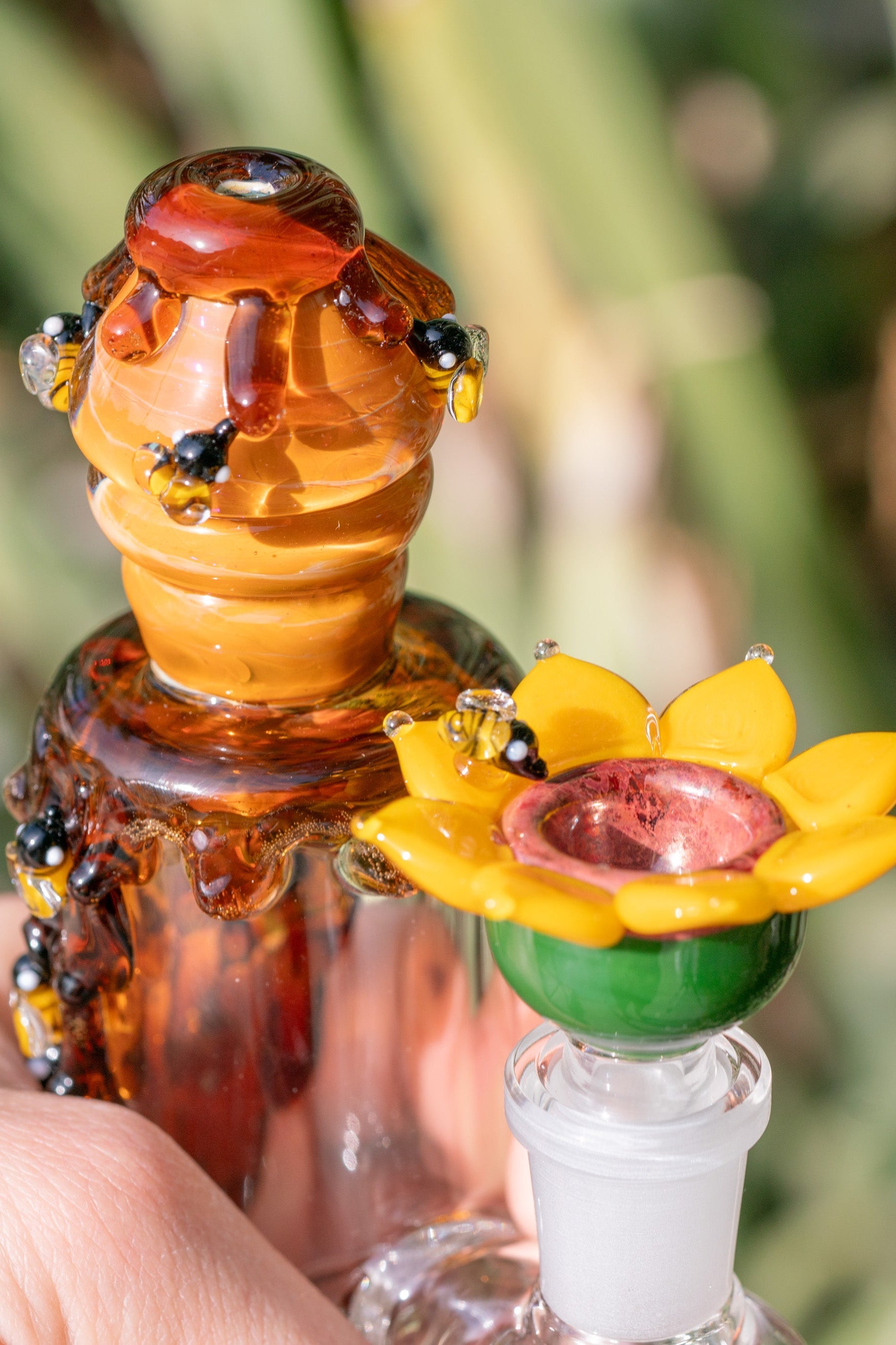 Intricate sculpted details on Empire Glassworks functional bee & flower glass