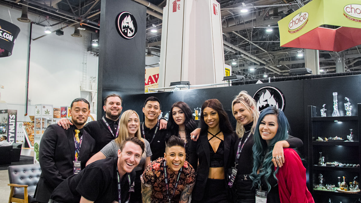 The team from Empire Glassworks working together at a glass and cannabis convention