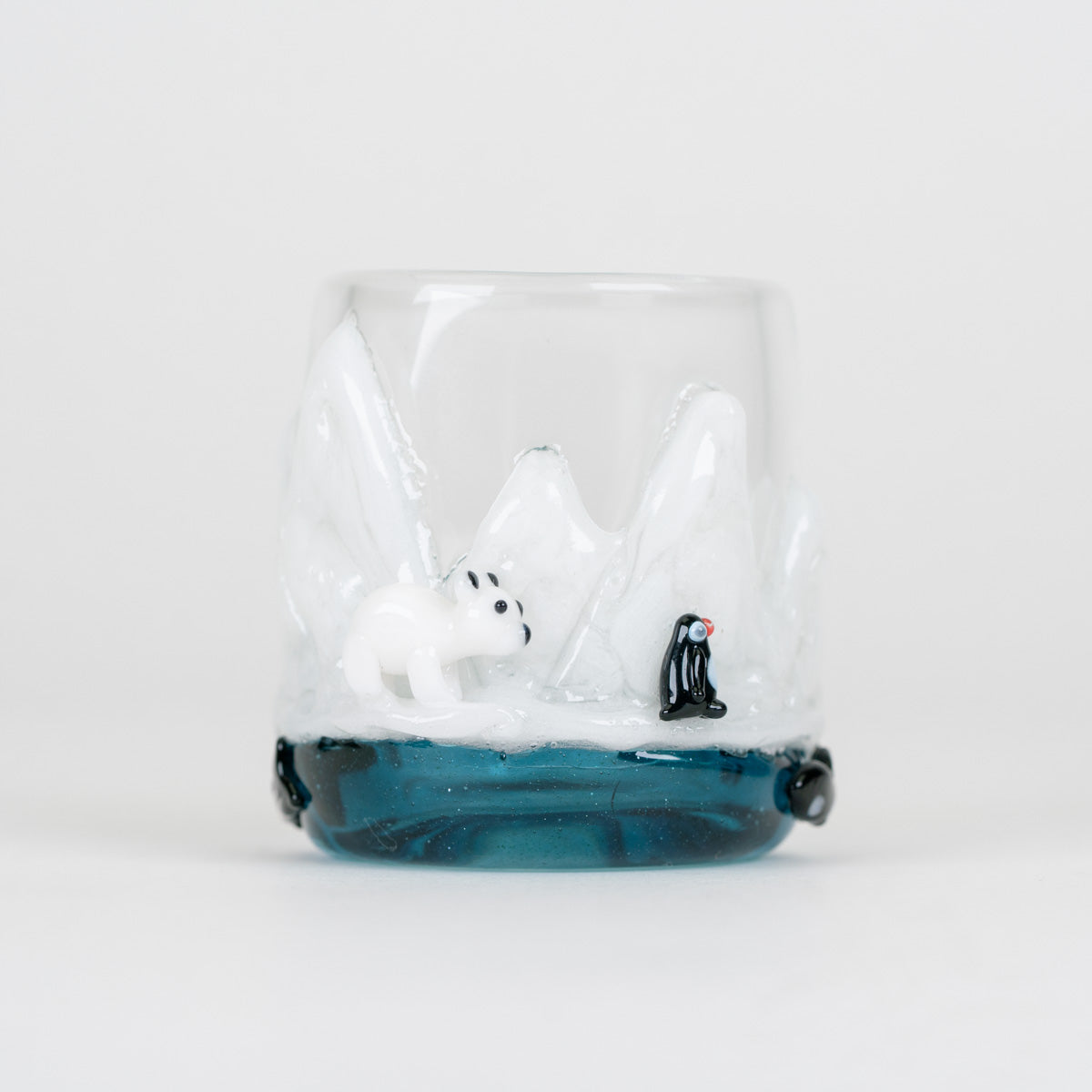 Handmade Avenge the Arctic Puffco Proxy Core glass attachment with transparent blue water and sculpted white ice