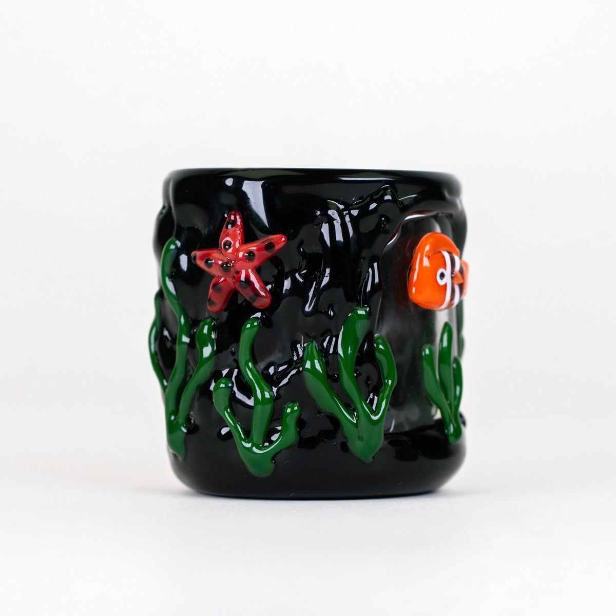 Empire Glassworks Puffco Proxy Core attachment featuring sculpted marine life against a glossy black glass background