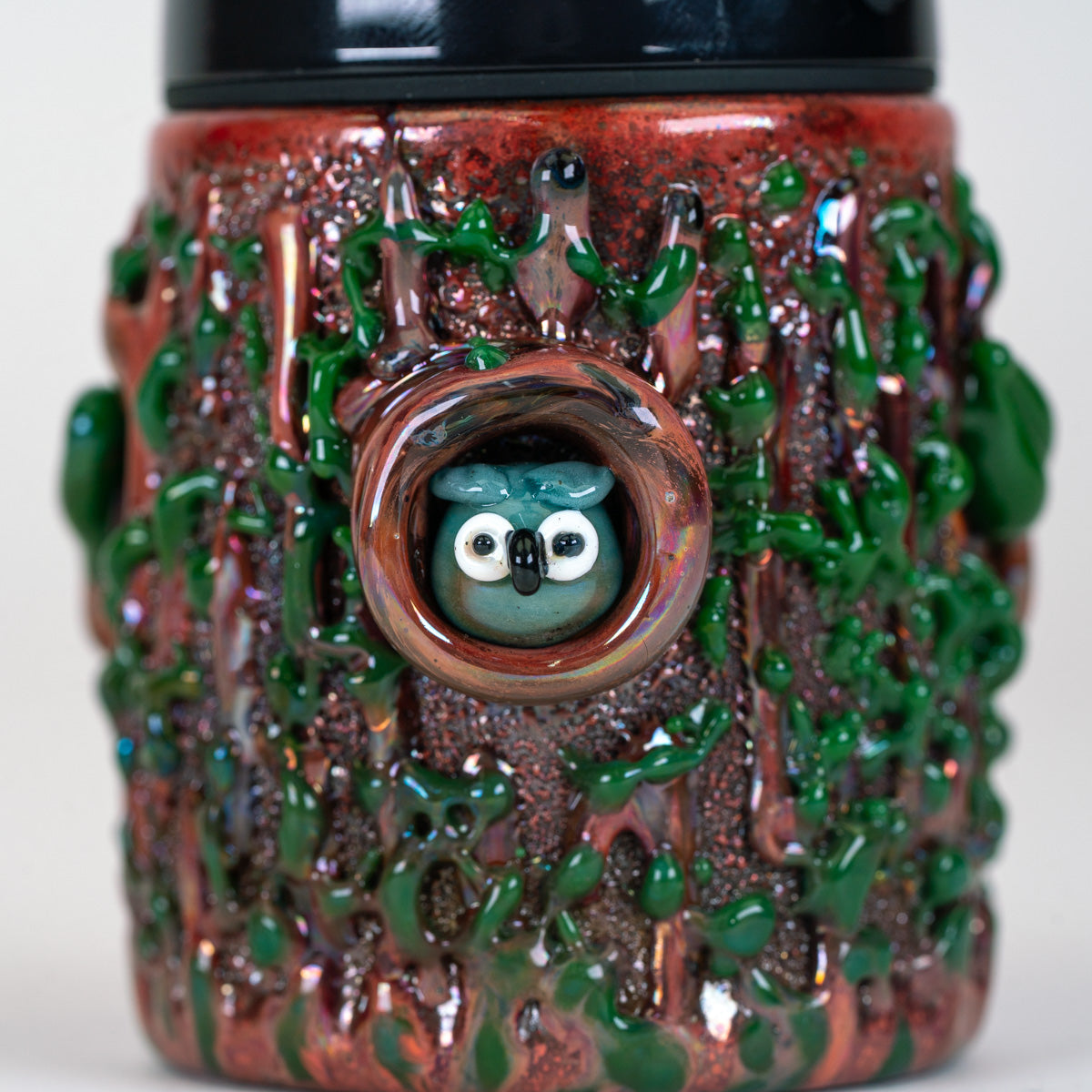 Close-up of the sculpted owl nestled inside the tree hollow on the Renew the Redwoods Proxy Core attachment