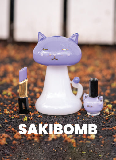 A purple glass lipstick pipe, kitty bong, and nail polish pipe all made by Empire Glassworks for Sakibomb