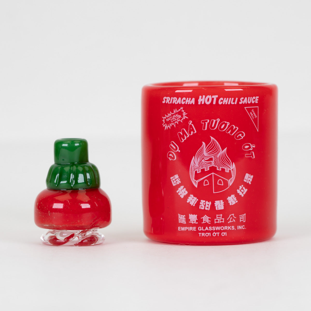 Handmade Sriracha Sauce Puffco Proxy Core glass attachment with red body, green cap, and white graphics